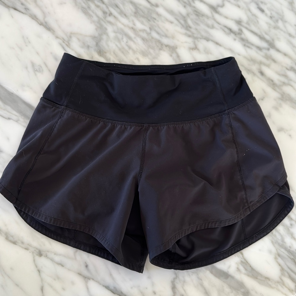 Lululemon Black speed up shorts 
Size 0